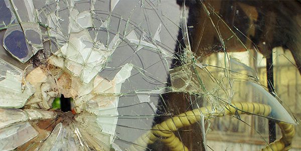 Who Is Responsible for Cracked Windshield if Dump Truck Loses Debris On the Road?